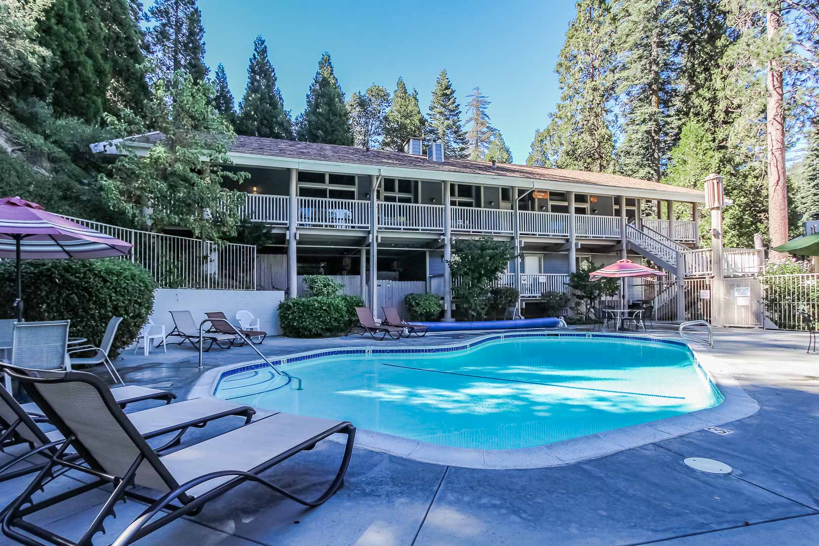 A peaceful view of the outdoor swimming pool at VRI's Lake Arrowhead Chalets in California.